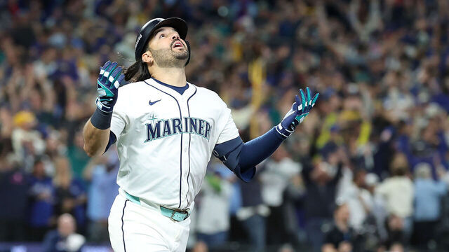 SEATTLE, WASHINGTON - OCTOBER 17: Eugenio Suárez #28 of the Seattle Mariners reacts after hitting a grand slam against the Toronto Blue Jays during the eighth inning to give the Mariners a 6-2 lead in game five of the American League Championship Series at T-Mobile Park on October 17, 2025 in Seattle, Washington.