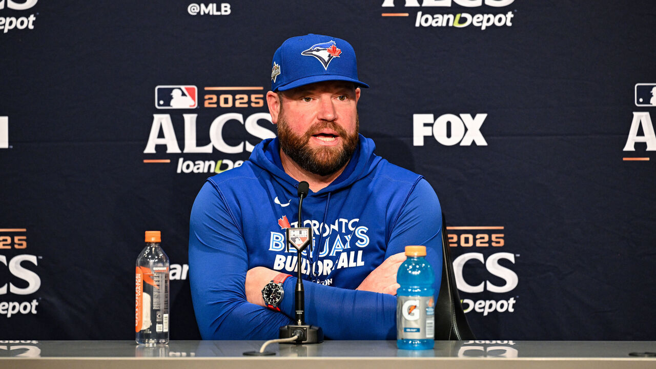 SEATTLE, WA - OCTOBER 17: Manager John Schneider #14 of the Toronto Blue Jays talks to media prior to Game Five of the American League Championship Series presented by loanDepot between the Toronto Blue Jays and the Seattle Mariners at T-Mobile Park on Friday, October 17, 2025 in Seattle, Washington.