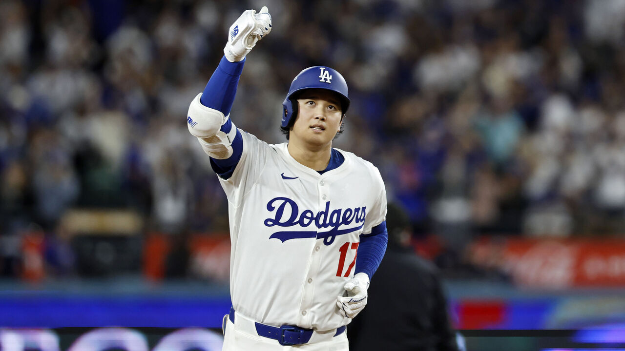 LOS ANGELES, CALIFORNIA - OCTOBER 17: Shohei Ohtani #17 of the Los Angeles Dodgers reacts as he runs the bases after hitting his third home run of the game in the seventh inning against the Milwaukee Brewers in game four of the National League Championship Series at Dodger Stadium on October 17, 2025 in Los Angeles, California.
