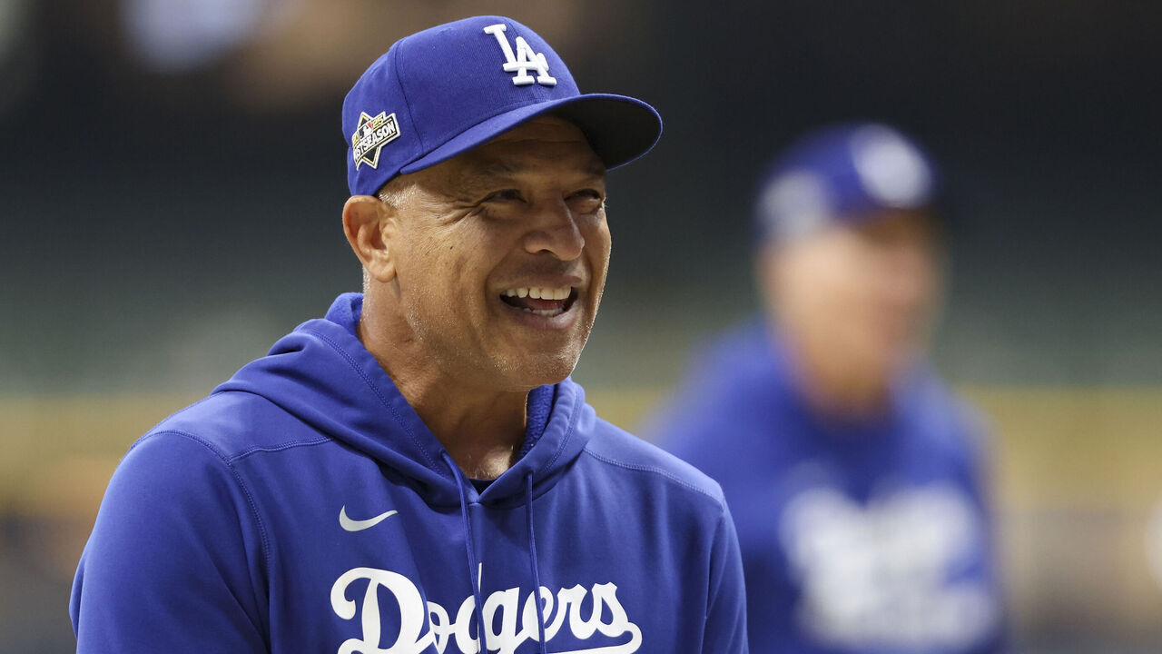 MILWAUKEE, WI - OCTOBER 13: Manager Dave Roberts #30 of the Los Angeles Dodgers looks on during warm ups prior to Game One of the National League Championship Series presented by Booking.com between the Los Angeles Dodgers and the Milwaukee Brewers at American Family Field on Monday, October 13, 2025 in Milwaukee, Wisconsin.