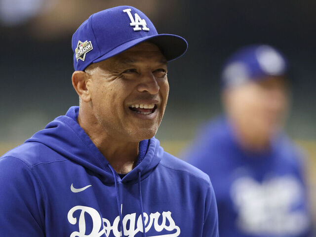 MILWAUKEE, WI - OCTOBER 13: Manager Dave Roberts #30 of the Los Angeles Dodgers looks on during warm ups prior to Game One of the National League Championship Series presented by Booking.com between the Los Angeles Dodgers and the Milwaukee Brewers at American Family Field on Monday, October 13, 2025 in Milwaukee, Wisconsin.