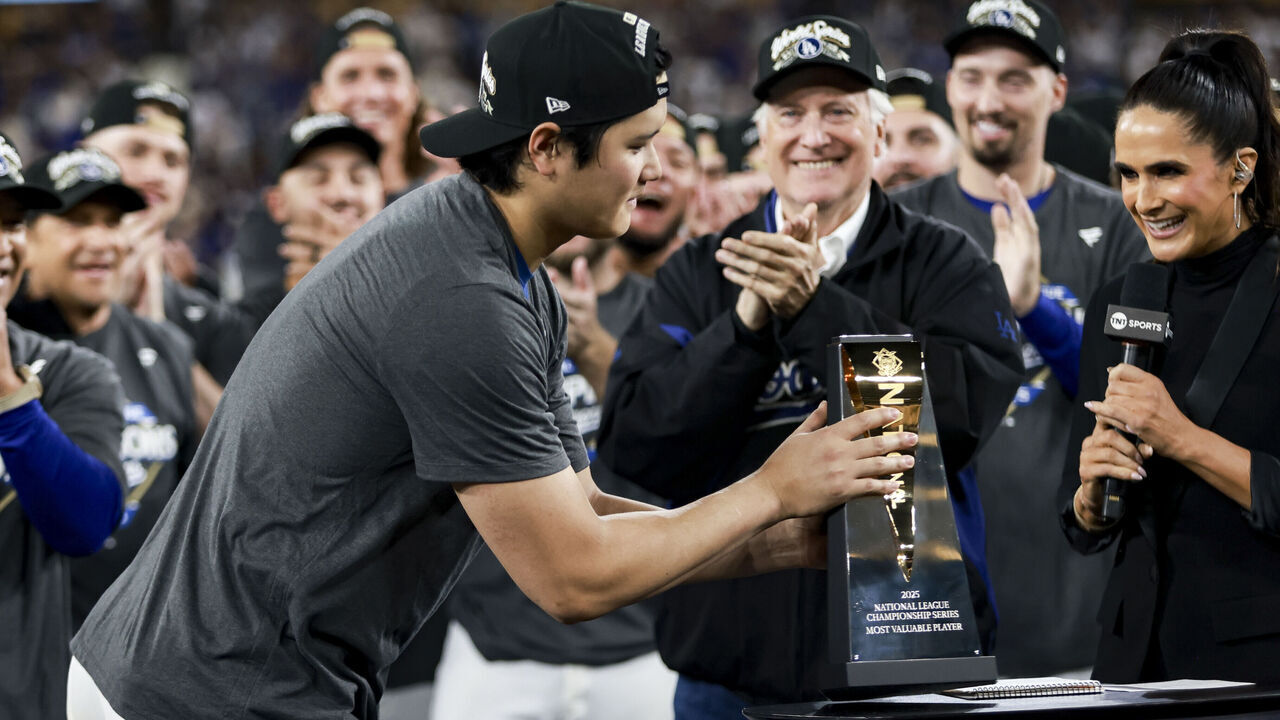 LOS ANGELES, CA - OCTOBER 17: Shohei Ohtani #17 of the Los Angeles Dodgers receives the MVP trophy after Game Four of the National League Championship Series presented by Booking.com between the Milwaukee Brewers and the Los Angeles Dodgers at Dodger Stadium on Friday, October 17, 2025 in Los Angeles, California.
