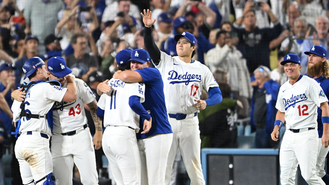 Los Angeles, CA - October 17:Dodgers cerebrate after the final out in game four of the NLCS, defeating the Brewers 5-1 in game four at Dodger Stadium on Friday, October 17, 2025. The Dodger swept the series and will face Toronto or Seattle in the World Series.