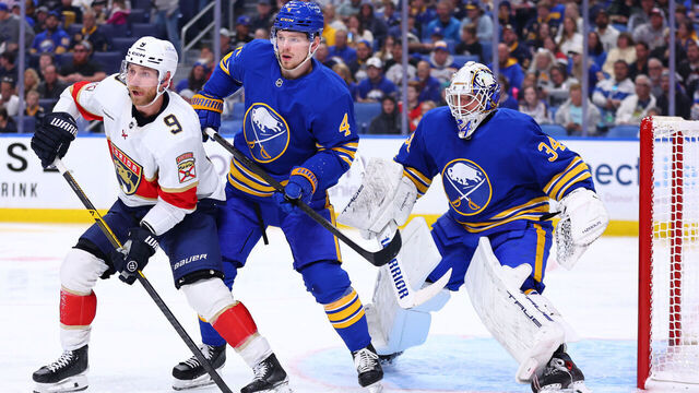BUFFALO, NEW YORK - OCTOBER 18: Sam Bennett #9 of the Florida Panthers screens Alex Lyon #34 of the Buffalo Sabres under pressure from Bowen Byram #4 of the Buffalo Sabresduring an NHL game on October 18, 2025 at KeyBank Center in Buffalo, New York.