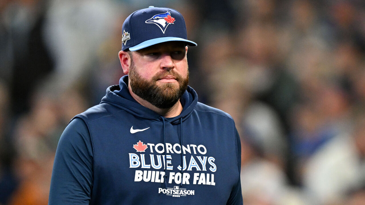 SEATTLE, WA - OCTOBER 17: Manager John Schneider #14 of the Toronto Blue Jays looks on in the fourth inning during Game Five of the American League Championship Series presented by loanDepot between the Toronto Blue Jays and the Seattle Mariners at T-Mobile Park on Friday, October 17, 2025 in Seattle, Washington.