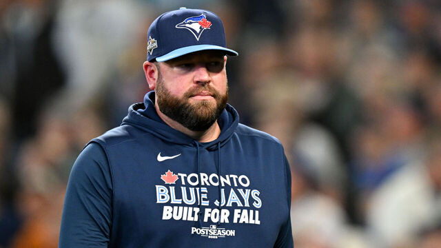 SEATTLE, WA - OCTOBER 17: Manager John Schneider #14 of the Toronto Blue Jays looks on in the fourth inning during Game Five of the American League Championship Series presented by loanDepot between the Toronto Blue Jays and the Seattle Mariners at T-Mobile Park on Friday, October 17, 2025 in Seattle, Washington.