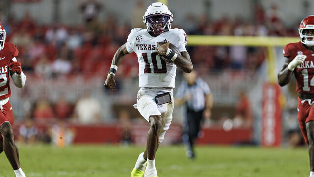FAYETTEVILLE, ARKANSAS - OCTOBER 18: Marcel Reed #10 of the Texas A&M Aggies runs the ball in the second half during a game against the Arkansas Razorbacks at Donald W. Reynolds Razorback Stadium on October 18, 2025 in Fayetteville, Arkansas. The Aggies defeated the Razorbacks 45-42.