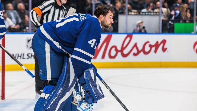 TORONTO, ON - OCTOBER 16: Toronto Maple Leafs goaltender Anthony Stolarz (41) picks up his mask during a break in the third period of an NHL game between the New York Rangers and the Toronto Maple Leafs on October 16, 2025, at Scotiabank Arena in Toronto, ON.