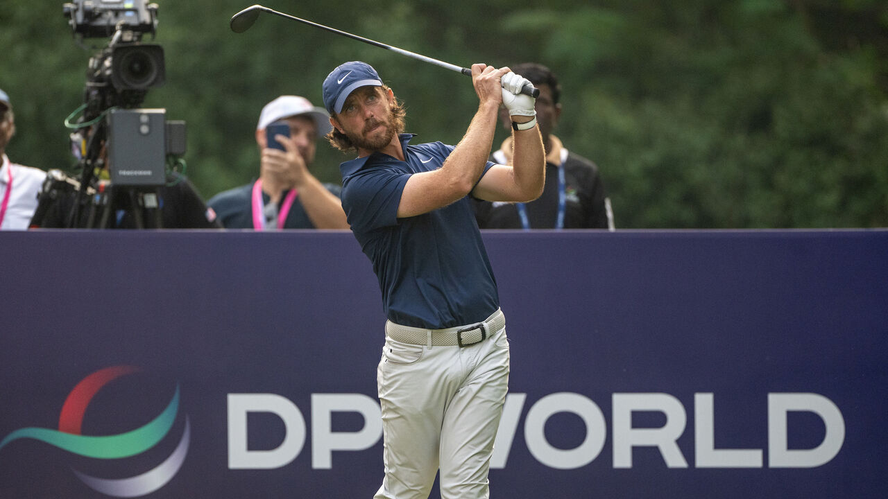 NEW DELHI, INDIA - OCTOBER 19: Tommy Fleetwood of England tees off on hole 18 on day four of the DP World India Championship 2025 at Delhi Golf Club on October 19, 2025 in New Delhi, India.