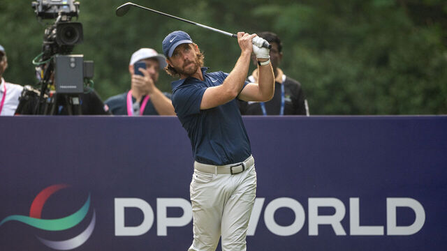 NEW DELHI, INDIA - OCTOBER 19: Tommy Fleetwood of England tees off on hole 18 on day four of the DP World India Championship 2025 at Delhi Golf Club on October 19, 2025 in New Delhi, India.