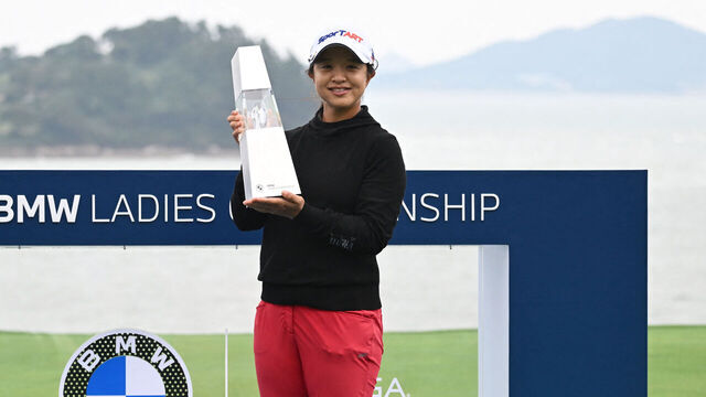Kim Sei-young of South Korea poses with the trophy after her victory in the LPGA Tour - BMW Ladies Championship golf tournament at Pine Beach Golf Links in Haenam on October 19, 2025.