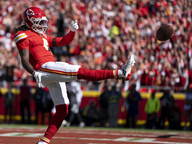 KANSAS CITY, MISSOURI - OCTOBER 19: Rashee Rice #4 of the Kansas City Chiefs kicks the ball as he celebrates scoring a touchdown during an NFL football game against the Las Vegas Raiders at GEHA Field at Arrowhead Stadium on October 19, 2025 in Kansas City, Missouri.