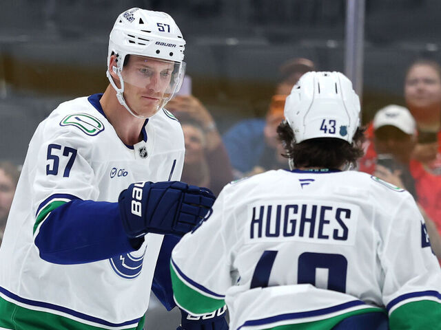 WASHINGTON, DC - OCTOBER 19: Tyler Myers #57 of the Vancouver Canucks celebrates his goal against the Washington Capitals during the first at Capital One Arena on October 19, 2025 in Washington, DC.