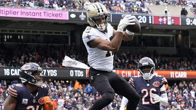 CHICAGO, ILLINOIS - OCTOBER 19: Chris Olave #12 of the New Orleans Saints catches a pass for a touchdown against the Chicago Bears during the third quarter at Soldier Field on October 19, 2025 in Chicago, Illinois.