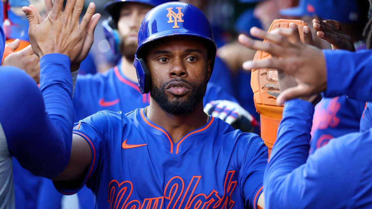 CINCINNATI, OH - SEPTEMBER 06: Cedric Mullins #28 of the New York Mets celebrates in the dugout with teammates after scoring a run in the third inning of the game between the New York Mets and the Cincinnati Reds at Great American Ball Park on Saturday, September 6, 2025 in Cincinnati, Ohio.
