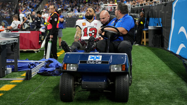 DETROIT, MICHIGAN - OCTOBER 20: Mike Evans #13 of the Tampa Bay Buccaneers is helped off the field after an injury during the first half of the game against the Detroit Lions at Ford Field on October 20, 2025 in Detroit, Michigan.