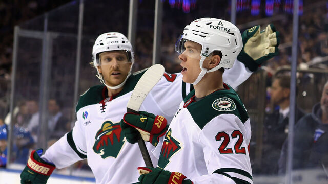 NEW YORK, NEW YORK - OCTOBER 20: Danila Yurov #22 of the Minnesota Wild (r) celebrates his game-winning goal, the first of his NHL career, against the New York Rangers at Madison Square Garden on October 20, 2025 in New York City. The Wild defeated the Rangers 3-1.
