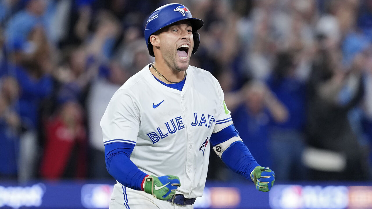 TORONTO, ONTARIO - OCTOBER 20: George Springer #4 of the Toronto Blue Jays celebrates after hitting a three-run home run against the Seattle Mariners during the seventh inning in game seven of the American League Championship Series at the Rogers Centre on October 20, 2025 in Toronto, Ontario.