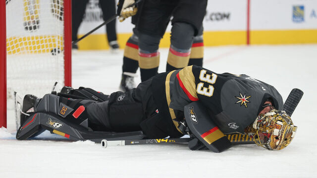 LAS VEGAS, NEVADA - OCTOBER 20: Adin Hill #33 of the Vegas Golden Knights reacts after suffering an injury during the first period against the Carolina Hurricanes at T-Mobile Arena on October 20, 2025 in Las Vegas, Nevada.