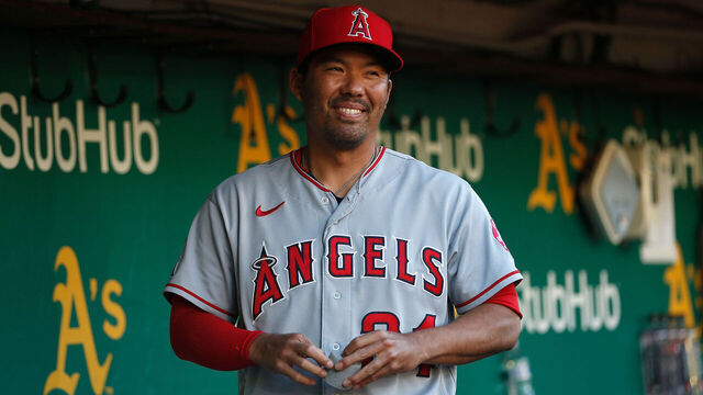 OAKLAND, CALIFORNIA - OCTOBER 04: Kurt Suzuki #24 of the Los Angeles Angels looks on from the dugout before the game against the Oakland Athletics at RingCentral Coliseum on October 04, 2022 in Oakland, California.