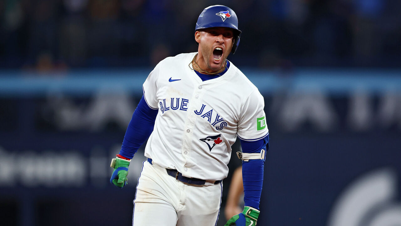 TORONTO, ONTARIO - OCTOBER 20: George Springer #4 of the Toronto Blue Jays celebrates after hitting a three-run home run against the Seattle Mariners during the seventh inning in game seven of the American League Championship Series at the Rogers Centre on October 20, 2025 in Toronto, Ontario.