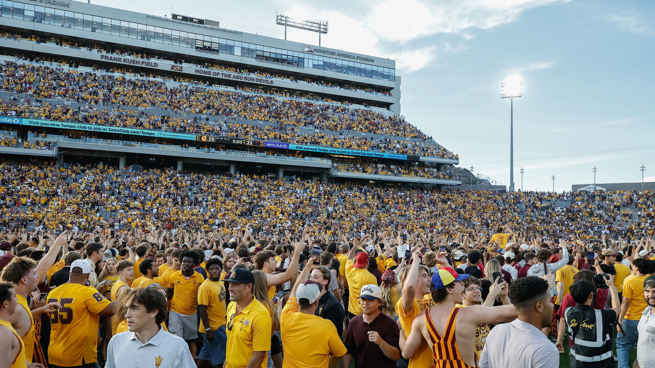 TEMPE, AZ - OCTOBER 18: Fans run onto the field after The Arizona State Sun Devils win after the college football game between the Texas Tech Red Raiders and the Arizona State Sun Devils on October 17, 2025 at Mountain America Stadium in Tempe, Arizona.