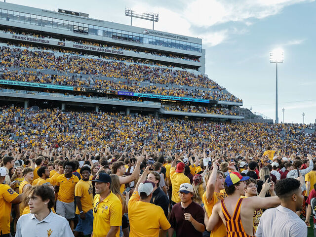 TEMPE, AZ - OCTOBER 18: Fans run onto the field after The Arizona State Sun Devils win after the college football game between the Texas Tech Red Raiders and the Arizona State Sun Devils on October 17, 2025 at Mountain America Stadium in Tempe, Arizona.