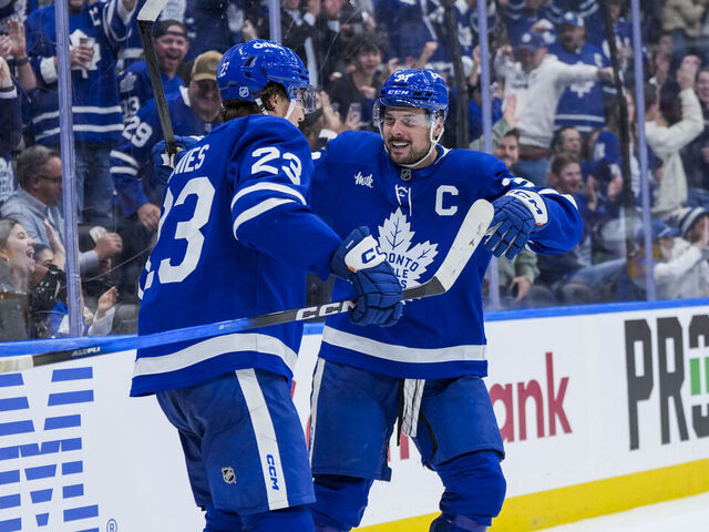 TORONTO, CANADA - OCTOBER 14: Auston Matthews #34 celebrates scoring a goal with Matthew Knies #23 of the Toronto Maple Leafs against the Nashville Predators during the third period at the Scotiabank Arena on October 14, 2025 in Toronto, ON, Canada.