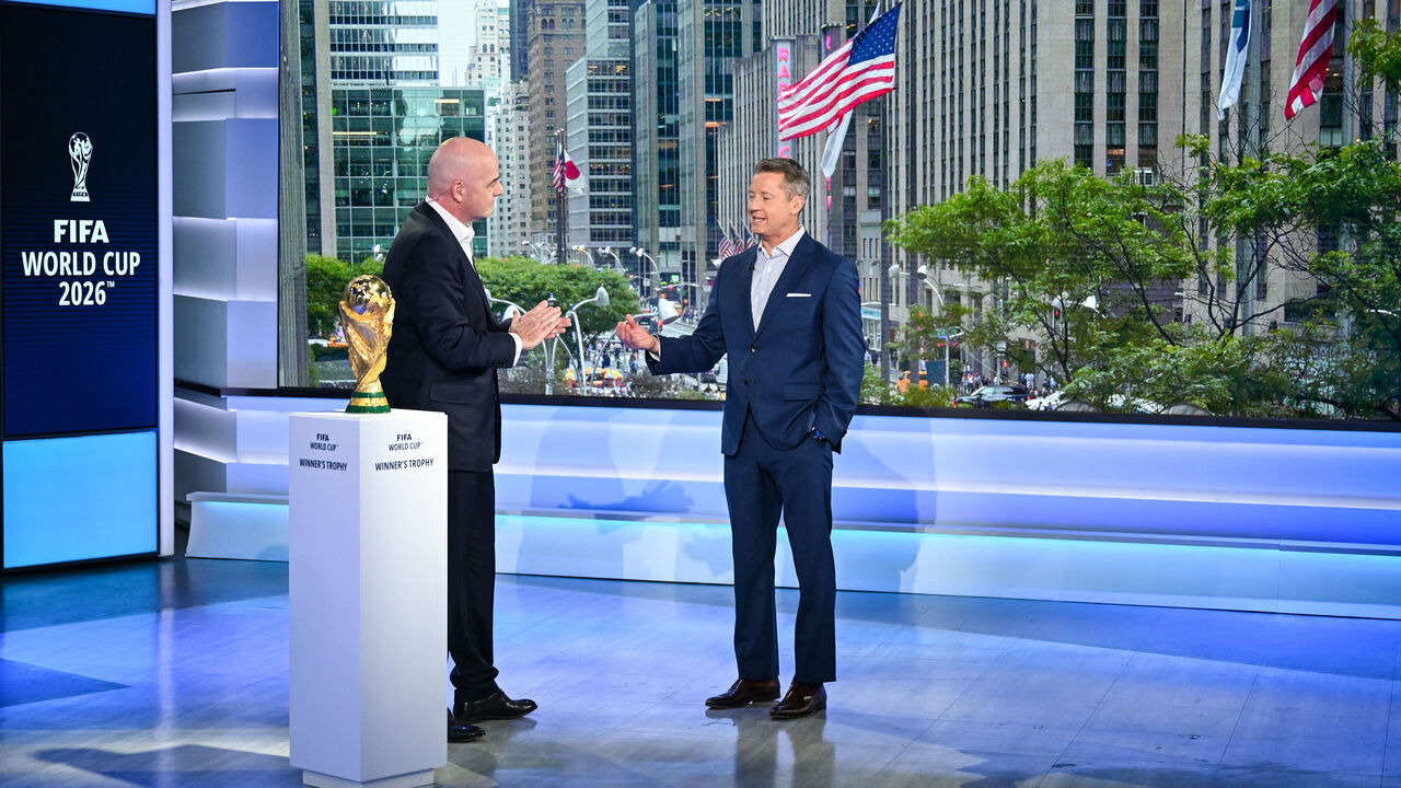 NEW YORK, USA JUNE 16: FIFA President Gianni Infantino (L) with Host and FOX Sports sportscaster Rob Stone and FIFA World Cup Winner's Trophy during the FIFA World Cup 2026 Host City Announcement on June 16, 2022 in New York, United States.