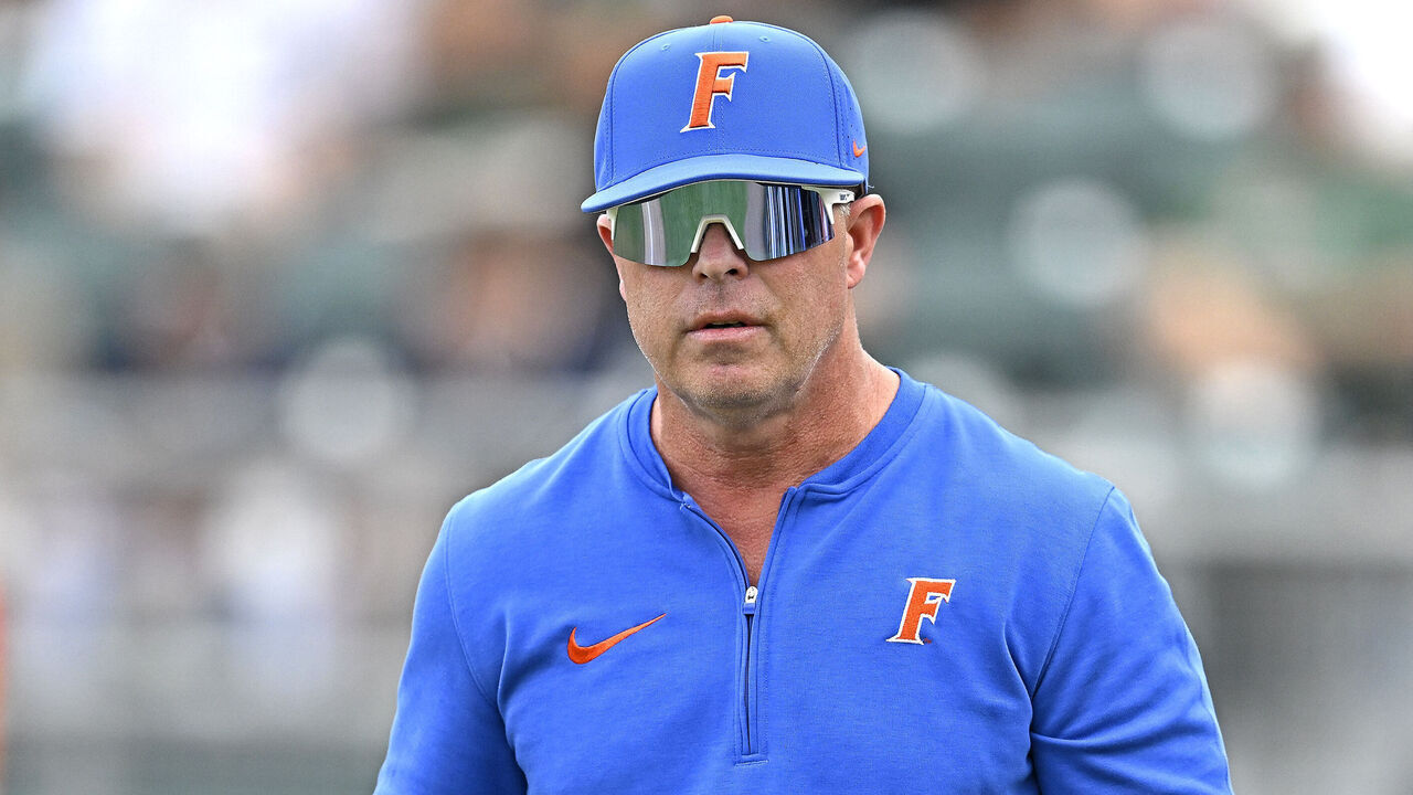 CORAL GABLES, FL - MARCH 02: Florida head coach Kevin O'Sullivan walks back to the dugout after protesting one of players being called out for a pitch clock violation in the seventh inning as the Miami Hurricanes faced the Florida Gators on March 2, 2024, at Mark Light Field at Alex Rodriguez Park in Coral Gables, Florida.