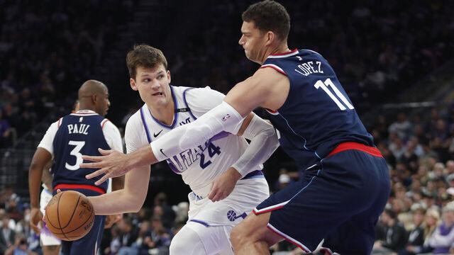 SALT LAKE CITY, UT - OCTOBER 22: Walker Kessler #24 of the Utah Jazz passes around Brook Lopez #11 of the Los Angeles Clippers during the second half at the Delta Center on October 22, 2025 in Salt Lake City, Utah.
