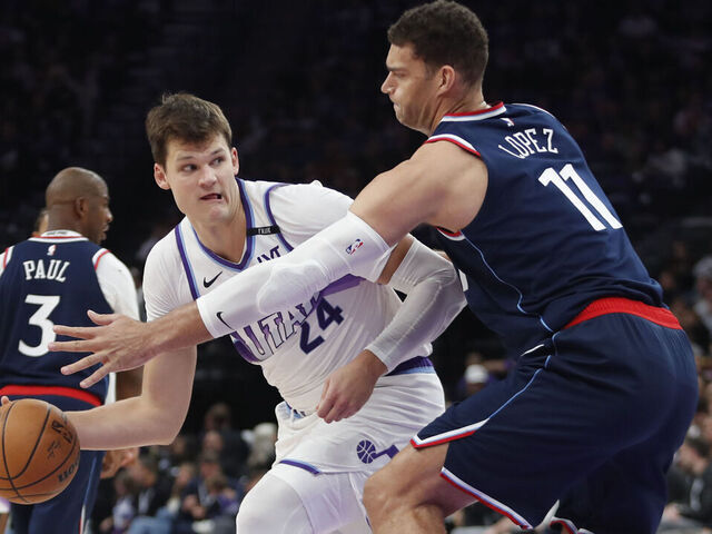 SALT LAKE CITY, UT - OCTOBER 22: Walker Kessler #24 of the Utah Jazz passes around Brook Lopez #11 of the Los Angeles Clippers during the second half at the Delta Center on October 22, 2025 in Salt Lake City, Utah.