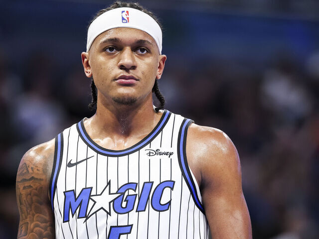 ORLANDO, FLORIDA - OCTOBER 16: Paolo Banchero #5 of the Orlando Magic looks on during the first half of a preseason game against the New Orleans Pelicans at the Kia Center on October 16, 2025 in Orlando, Florida. NOTE TO USER: User expressly acknowledges and agrees that, by downloading and/or using this Photograph, user is consenting to the terms and conditions of the Getty Images License Agreement
