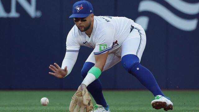 TORONTO, ON - JULY 22 - Toronto Blue Jays shortstop Bo Bichette (11) fields a grounder from New York Yankees shortstop Anthony Volpe (11) in the second inning as the Toronto Blue Jays play the New York Yankees at Rogers Centre in Toronto. July 22, 2025.