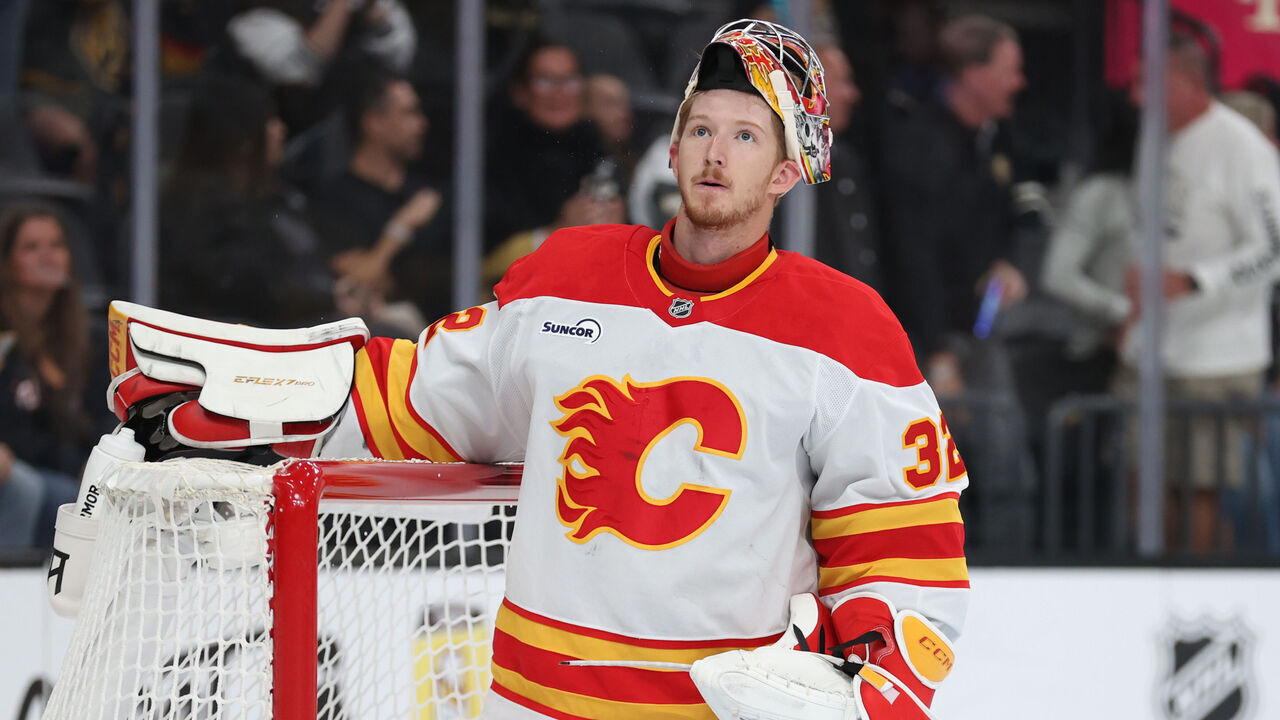 LAS VEGAS, NEVADA - OCTOBER 18: Dustin Wolf #32 of the Calgary Flames reacts after allowing a goal during the second period against the Vegas Golden Knights at T-Mobile Arena on October 18, 2025 in Las Vegas, Nevada.
