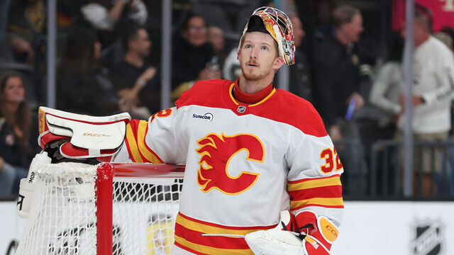 LAS VEGAS, NEVADA - OCTOBER 18: Dustin Wolf #32 of the Calgary Flames reacts after allowing a goal during the second period against the Vegas Golden Knights at T-Mobile Arena on October 18, 2025 in Las Vegas, Nevada.
