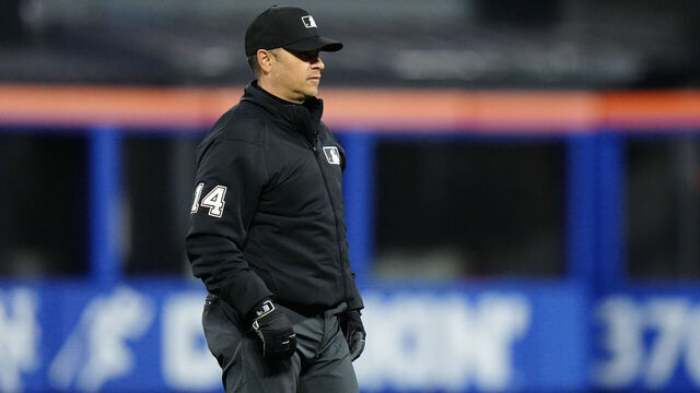 NEW YORK, NY - APRIL 21: Umpire Mark Wegner #14 looks on in the first inning during the game between the Philadelphia Phillies and the New York Mets at Citi Field on Monday, April 21, 2025 in New York, New York.