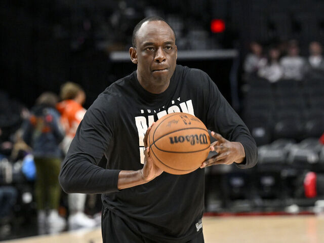 PORTLAND, OREGON - APRIL 09: Assistant coach Roy Rogers of the Portland Trail Blazers helps players warm up before the game \V| at the Moda Center on April 09, 2024 in Portland, Oregon.