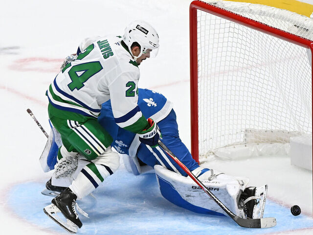 DENVER, COLORADO - OCTOBER 23: Seth Jarvis #24 of the Carolina Hurricanes scores in a penalty shootout against the Colorado Avalanche at Ball Arena on October 23, 2025 in Denver, Colorado.