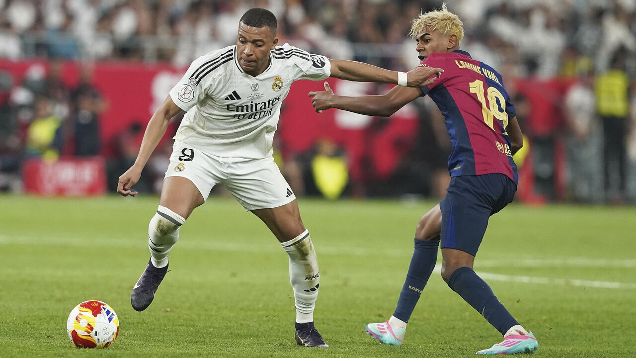 Seville, Spain - April 26: Kylian Mbappe of Real Madrid CF and Lamine Yamal of FC Barcelona battle for the ball during the Copa del Rey Final macht between FC Barcelona and Real Madrid at Estadio de La Cartuja on April 26, 2025 in Seville, Spain.