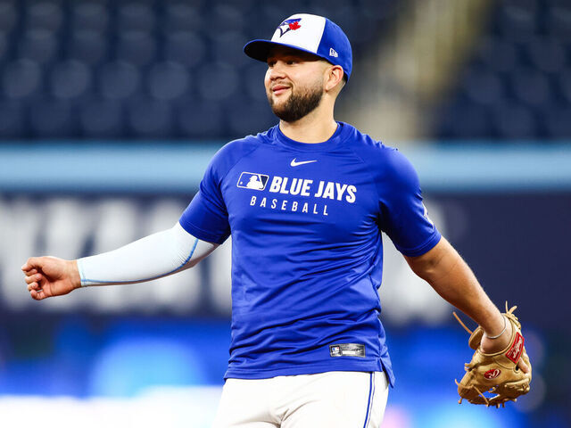 TORONTO, CANADA - OCTOBER 23: Bo Bichette #11 of the Toronto Blue Jays works out in the infield during World Series Workout Day ahead of Game 1 of the World Series at Rogers Centre on October 23, 2025 in Toronto, Ontario, Canada.