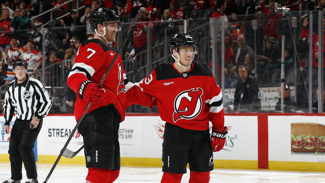 NEWARK, NEW JERSEY - OCTOBER 24: Jesper Bratt #63 celebrates with Dougie Hamilton #7 of the New Jersey Devils after Hamilton's goal during the second period against the San Jose Sharks at Prudential Center on October 24, 2025 in Newark, New Jersey.