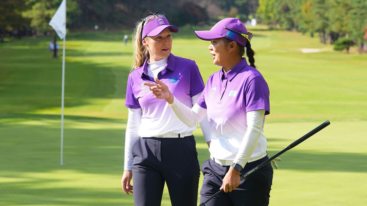 GOYANG, SOUTH KOREA - OCTOBER 25: Brooke Henderson and Hsu Wei-ling of the World Team speak after holing out on the 15th green after the Pool B match against Sweden Team on day three of the Hanwha LIFEPLUS International Crown 2025 at New Korea Country Club on October 25, 2025 in Goyang, South Korea.