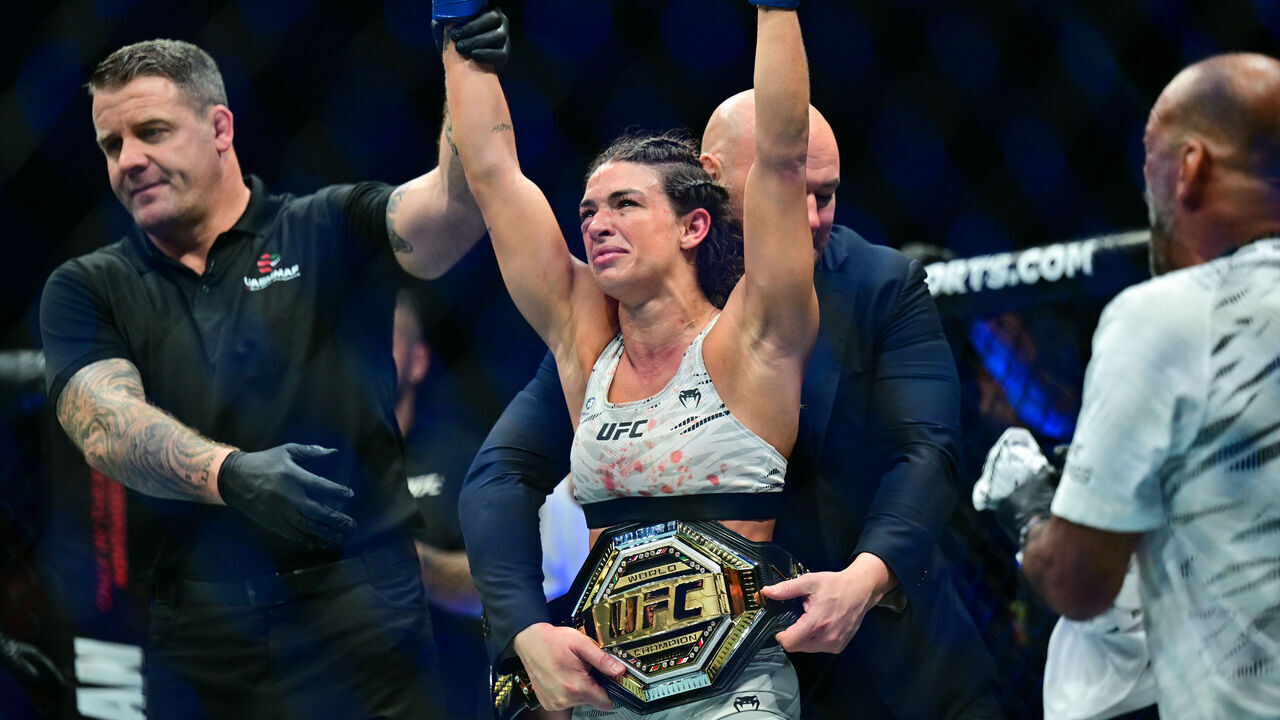 TOPSHOT - Brazilian-American Mackenzie Dern reacts after defeating Brazil's Virna Jandiroba during their strawweight bout at UFC 321 at Etihad Arena in Abu Dhabi early on October 26, 2025.