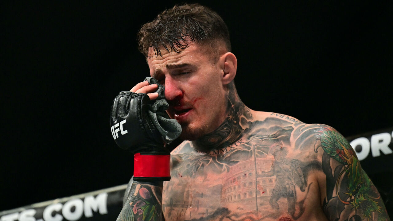 Britain's Tom Aspinall reacts after being hit in the eye while fighting France's Ciryl Gane during their UFC heavyweight title bout at UFC 321 at Etihad Arena in Abu Dhabi early on October 26, 2025.