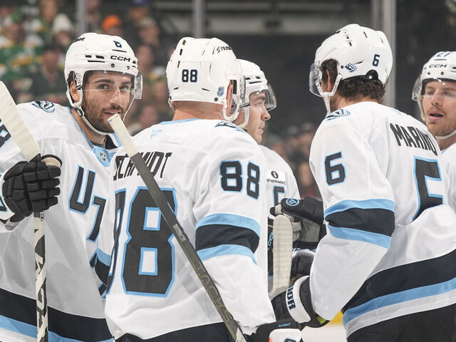 SAINT PAUL, MN - OCTOBER 25: Nick Schmaltz #8 celebrates his goal with his teammates Nate Schmidt #88, John Marino #6 and Barrett Hayton #27 of the Utah Mammoth against the Minnesota Wild during the game at Grand Casino Arena on October 25, 2025 in Saint Paul, Minnesota.