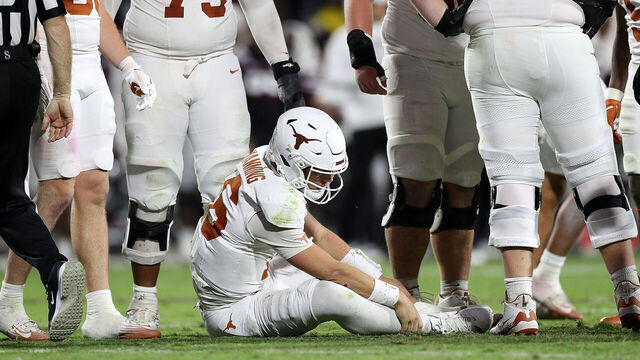 STARKVILLE, MISSISSIPPI - OCTOBER 25: Arch Manning #16 of the Texas Longhorns grabs his leg during the second half against the Mississippi State Bulldogs at Davis Wade Stadium on October 25, 2025 in Starkville, Mississippi.