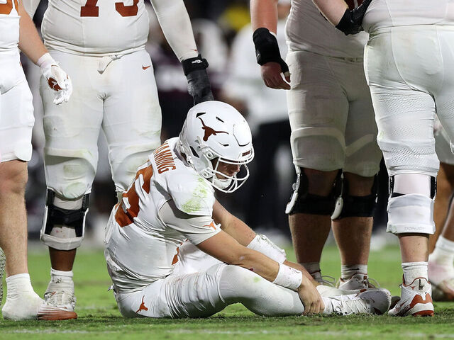 STARKVILLE, MISSISSIPPI - OCTOBER 25: Arch Manning #16 of the Texas Longhorns grabs his leg during the second half against the Mississippi State Bulldogs at Davis Wade Stadium on October 25, 2025 in Starkville, Mississippi.