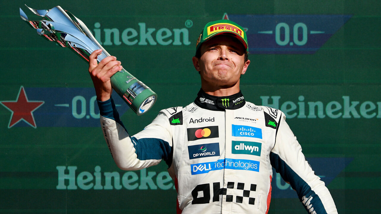 MEXICO CITY, MEXICO - OCTOBER 26: Race winner Lando Norris of Great Britain and McLaren on the podium with his trophy during the F1 Grand Prix of Mexico at Autodromo Hermanos Rodriguez on October 26, 2025 in Mexico City, Mexico.