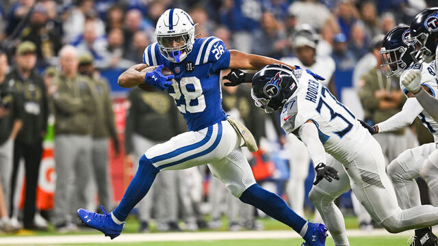 INDIANAPOLIS, IN - OCTOBER 26: Indianapolis Colts Running Back Jonathan Taylor (28) escapes the tackle of Tennessee Titans Safety Amani Hooker (37) during the NFL game between the Tennessee Titans and the Indianapolis Colts on October 26, 2025, at Lucas Oil Stadium in Indianapolis, Indiana.